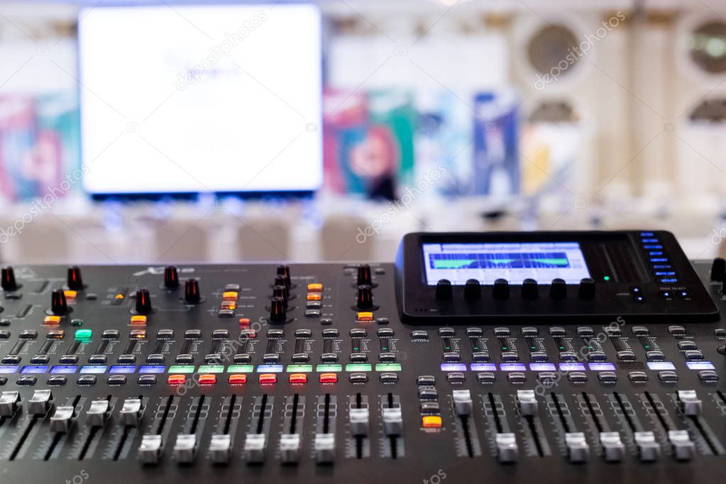 Professional Audio Sound Mixing Console Faders in seminar room.