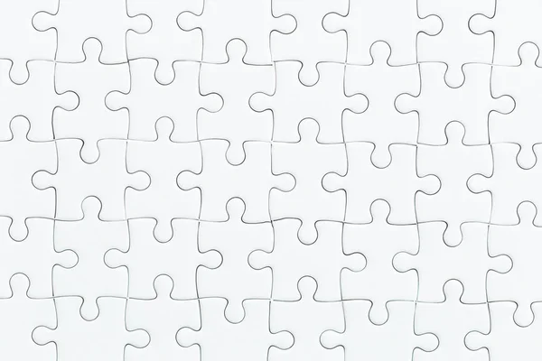 close up white jigsaw game puzzle. texture background.