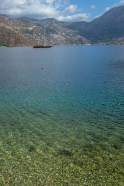 Scenes from the sea, sailboat anchored in the bay.