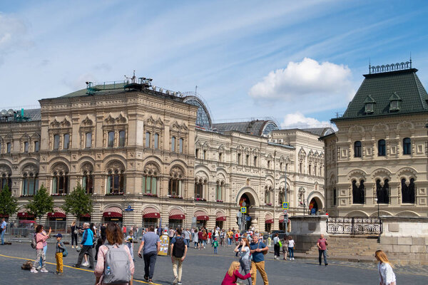 Moscow - August 3, 2020. A crowd of tourists on Krasnaya Ploshad near the GUM store and the place of execution