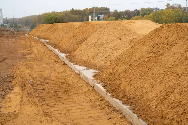 Piles of sand on the construction site of a residential neighborhood