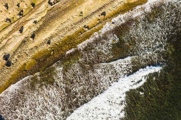 Aerial view of coast of Curaao in Caribbean Sea with turquoise water, cliff and beautiful coral reef