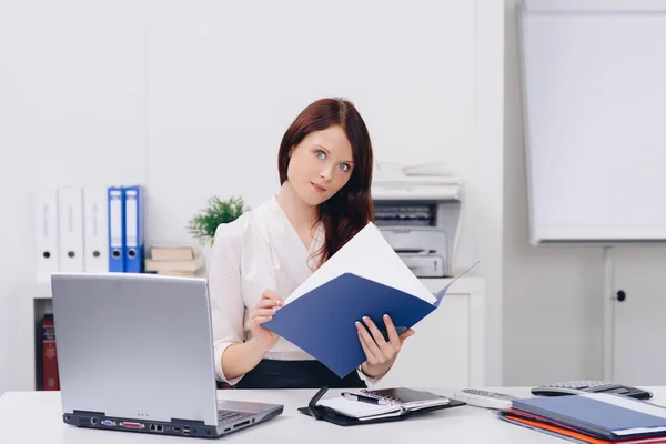 attractive woman in office holding cv map