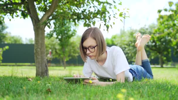 Young Student Girl Lying Tree Park Yard Home Tablet Her — Stock Video