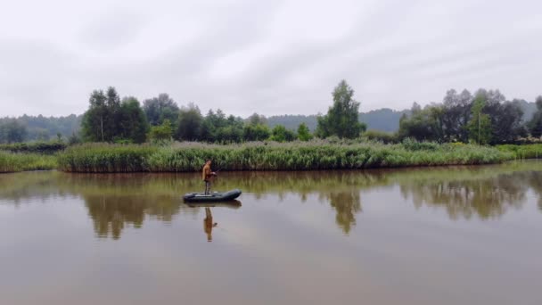 Young Man Fishing Middle Lake Standing Boat Fisherman Holds Rod — Stock Video