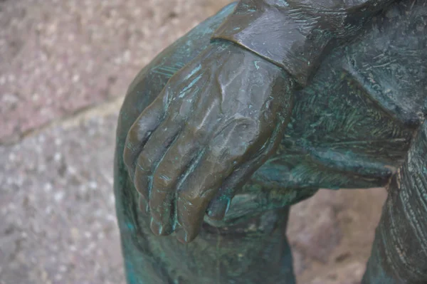 portrait of the hand of a metal statue