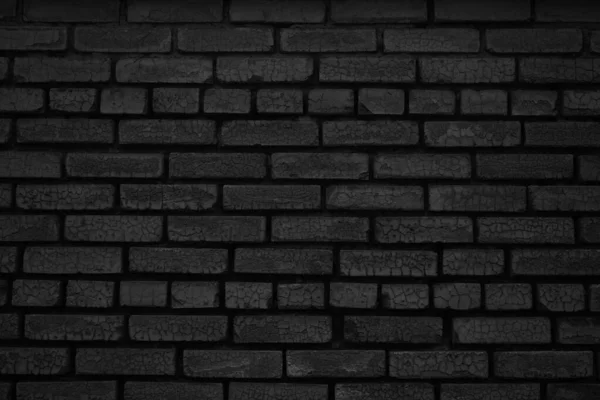 Black brick wall texture background. Black grunge background. Old brick wall with cracks.