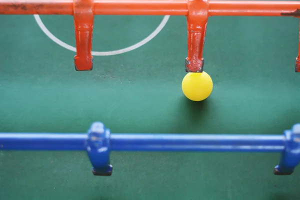 Foosball. Soccer table game, blue foosball player. Toy sport game concept.
