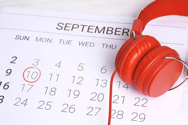 Calendar with headphones. Musical september calendar. Music and Organization management concept.