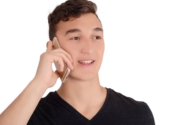 Młody Człowiek Uśmiechający Się Rozmawia Przez Telefon Podczas Patrząc Hotelu — Zdjęcie stockowe