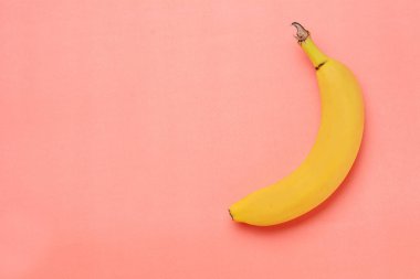 Top view. Banana on pink background. Healty concept clipart