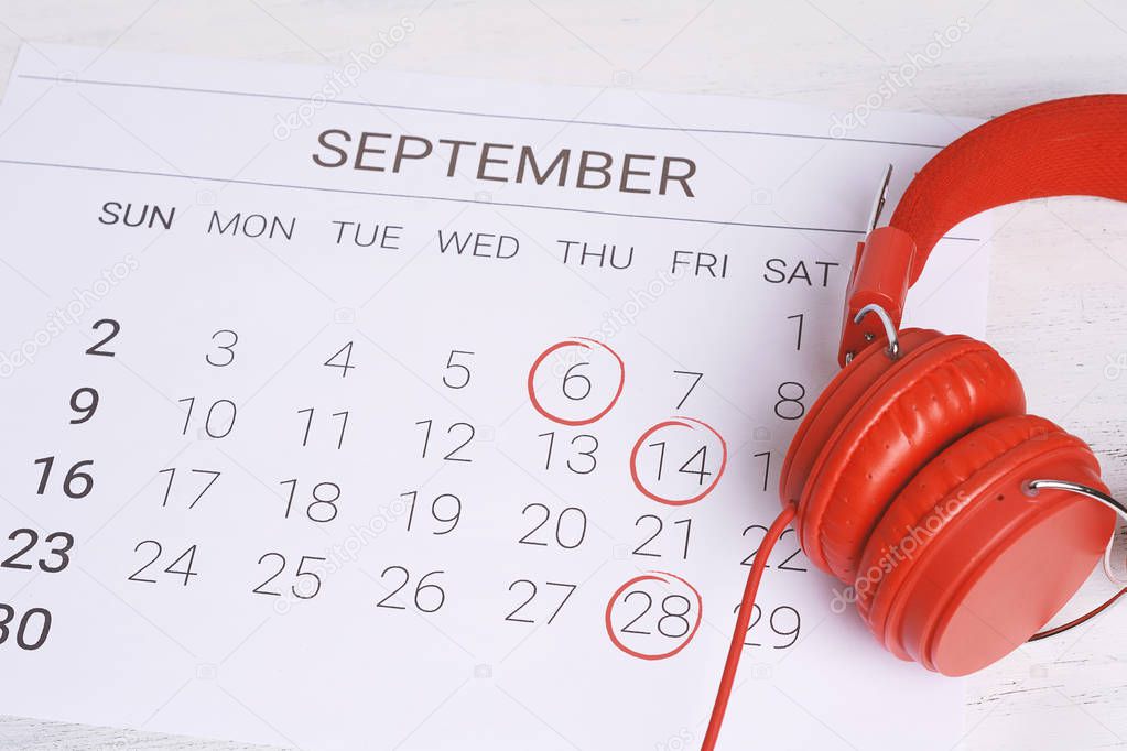 Calendar with headphones. Musical september calendar. Music and Organization management concept.