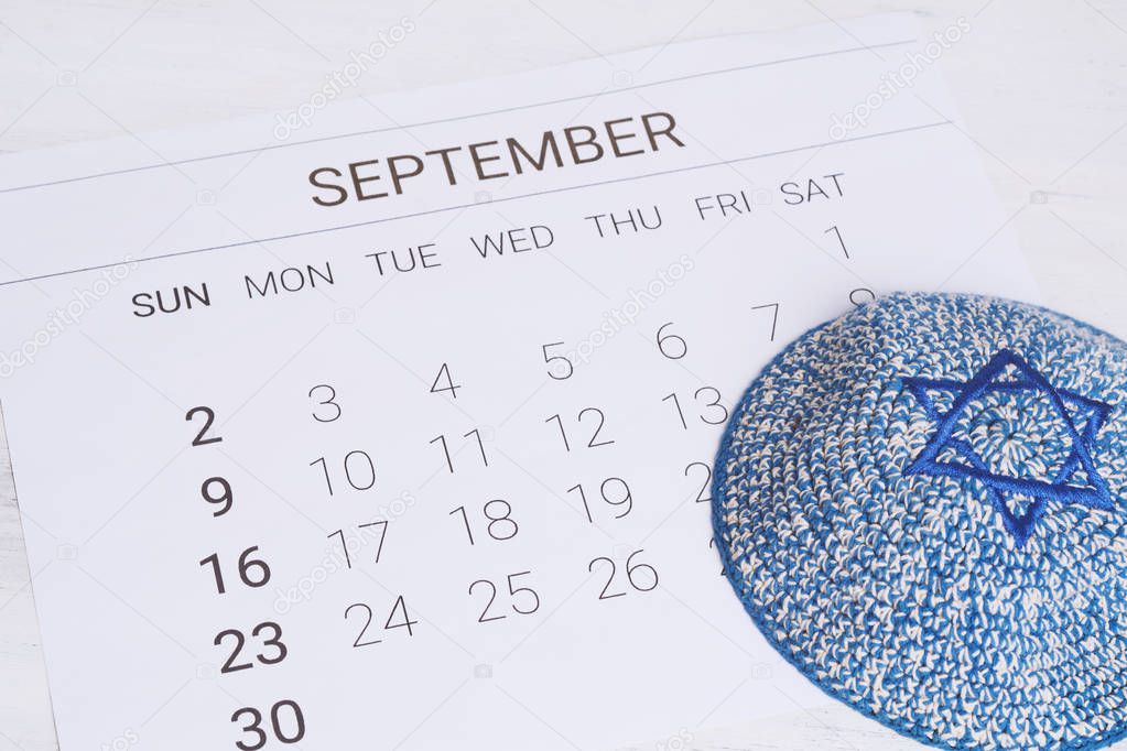 2018 September calendar with kippah. Rosh Hashana, Yom Kippur and Sukkot. Jewish festivities concept.