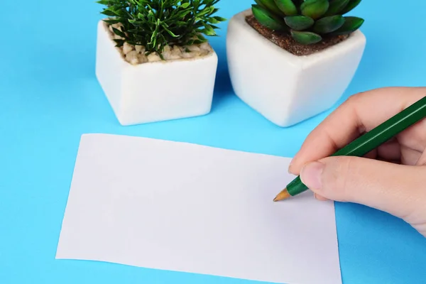 Mulher Mãos Escrevendo Folha Papel Branco Com Caneta Luz Azul — Fotografia de Stock