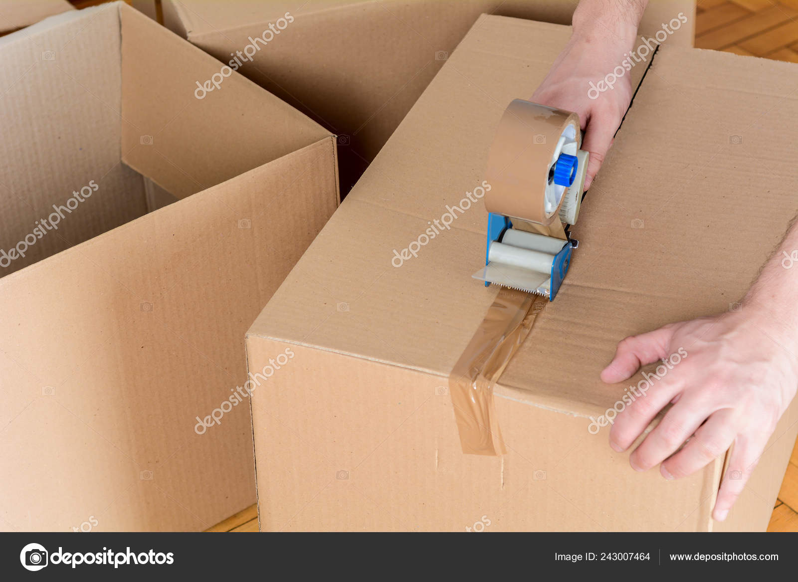 Man Sealing Shipping Cardboard Box Tape Dispenser Indoors Stock Photo