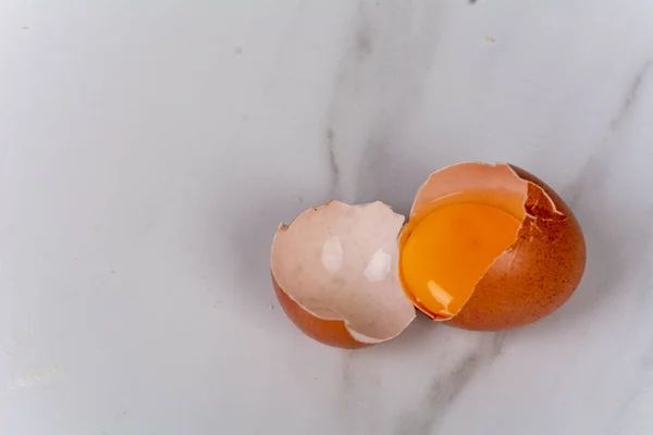 Close-up to a broken egg. Cooking concept.