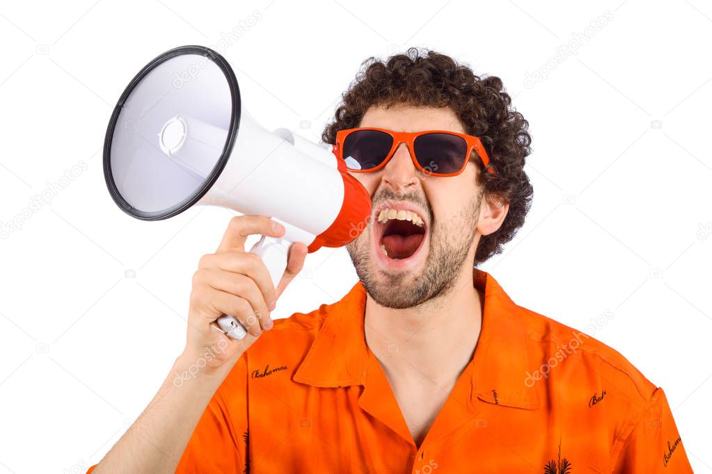 Young tourist man screaming on a megaphone.