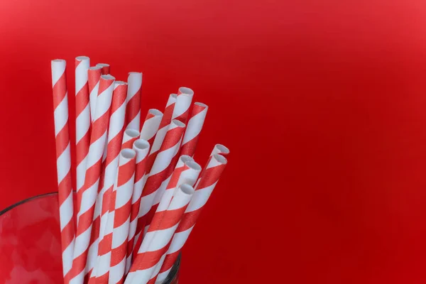 Red drinking straws in a glass — Stock Photo, Image