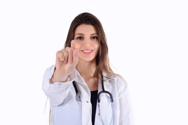 Dokter wanita dengan stetoskop dan pil . — Stok Foto