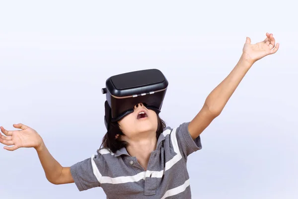Little boy playing video games with VR.