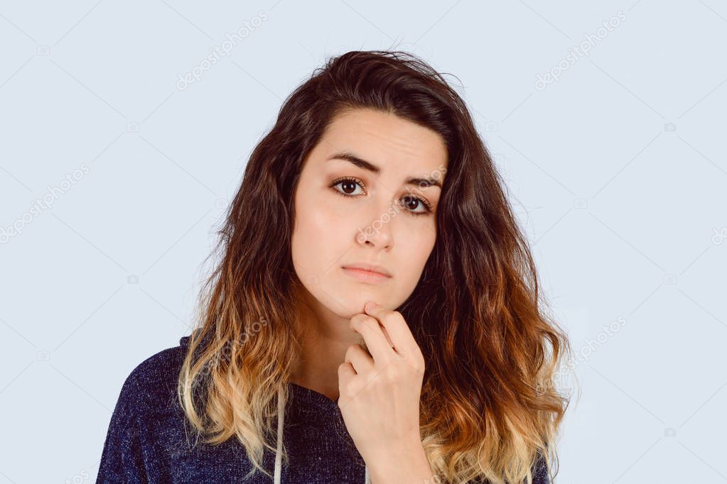 Portrait of young woman thinking.