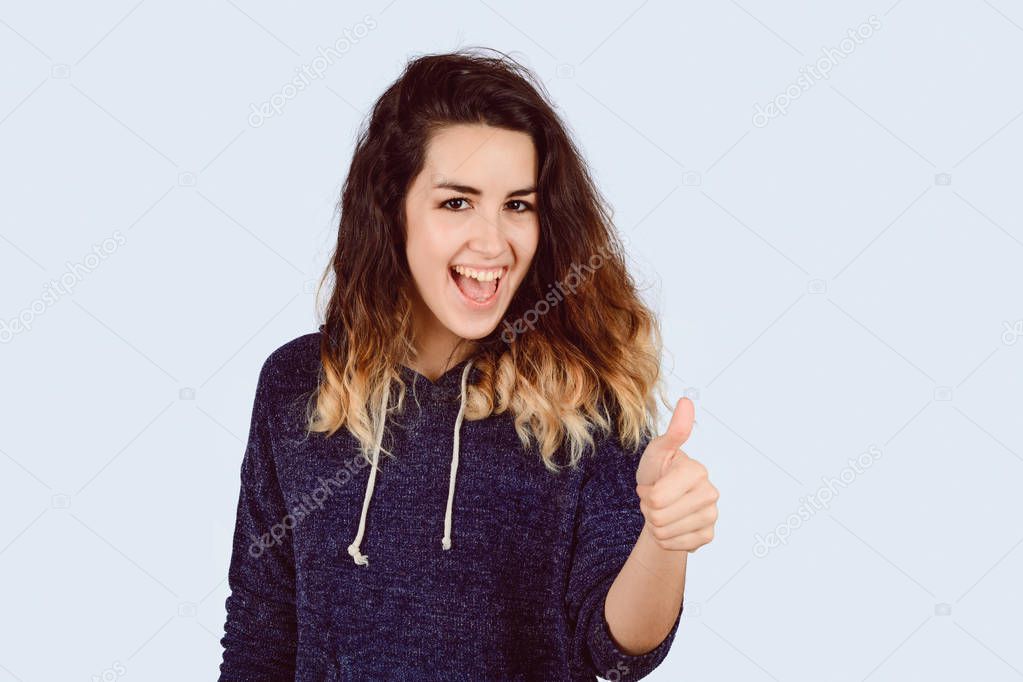 Young woman with thumbs up.