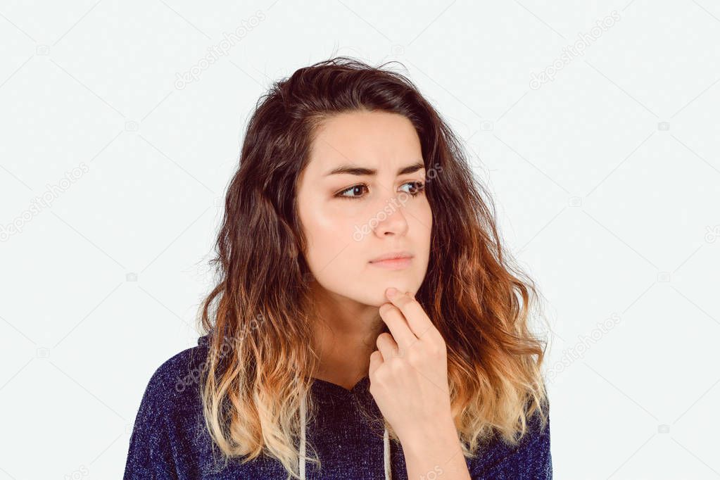 Portrait of young woman thinking.