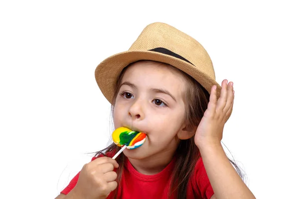 Klein meisje eet een lolly. — Stockfoto