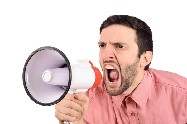 Mladý muž křičí na megafon. — Stock fotografie