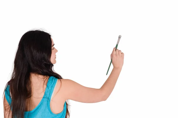 Mujer joven pintando con pincel . —  Fotos de Stock