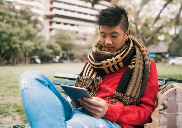 Portrait Young Asian Man Using His Digital Tablet While Sitting — Stock Photo, Image