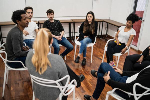 Group of multiethnic creative business people working on a project and having a brainstorming meeting. Team work and brainstorming concept.