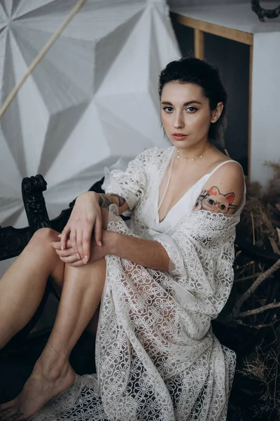 Young Woman Vintage White Dress Sitting Wooden Bench Looking Camera — Stock Photo, Image