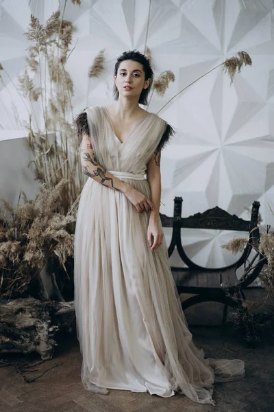 Smiling Young Woman Posing Long Dress Studio Decorations Looking Camera — Stock Photo, Image