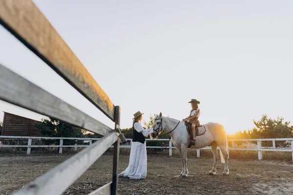 Girl Riding Horse While Mother Stroking Her Horse Ranch Sunset — Stock Photo, Image