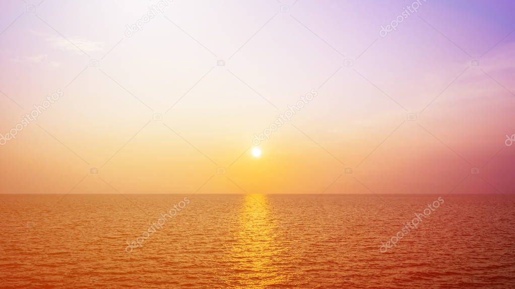 the sun shines golden in the evening on sea.
