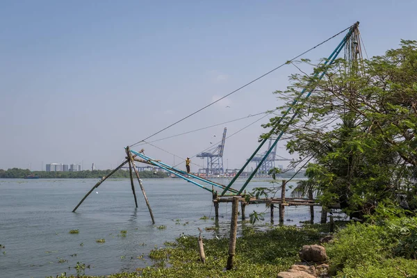 Fort Kochi, India - 16th November 2017: A view of the famous chinese stationary fishing nets on the shore side within the historic old town of Kochi, Kerala, India.
