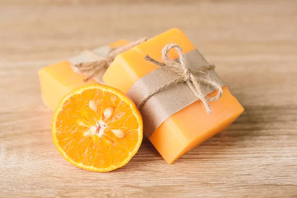 Orange soap wrapping with paper and ribbon, herbal homemade soap