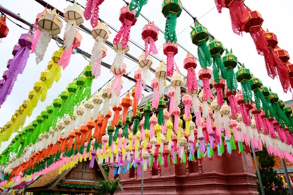Colorful paper lanterns Lanna style hanging for worship or respect of buddha at Thai temple (Wat Phra That Hariphunchai, Lamphun province), Lanterns festival in Loy Krathong or Yee Peng in northern of Thailand