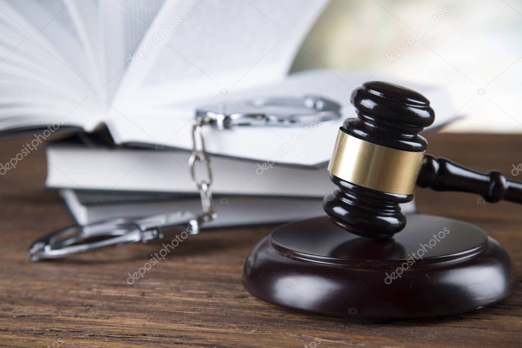 Lawyers office background. Law symbols composition on gray stone background.