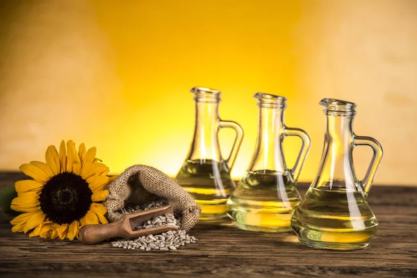 Sunflower oil in a bottle and sunflower flowers and sunflower se