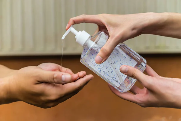 Washing hands with alcohol gel prevent the spread of germs and bacteria and avoid infections corona COVID-19 virus. Washing Hands together by using alcohol gel. Healthcare and medical concept.