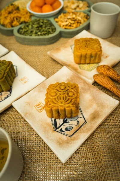 Mid-Autumn Festival moon cake, colorful food and drink on burlap background. Travel. holiday, food concept