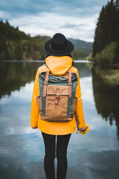 Back View Stylish Hipster Woman Holding Flowers Wearing Vintage Backpack — Stock Photo, Image