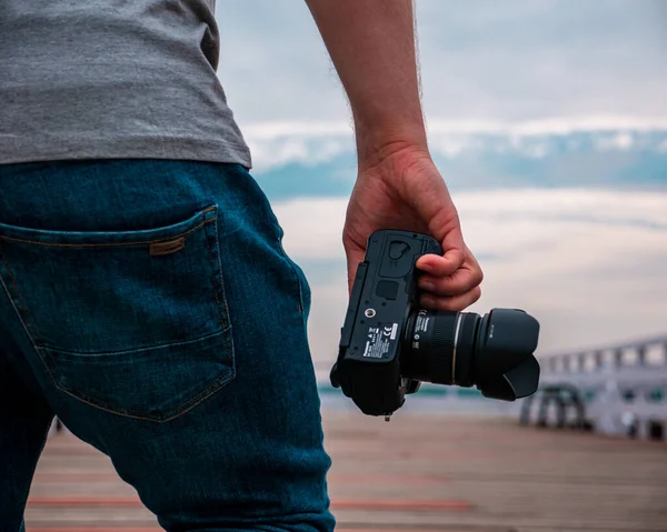 Photographer Camera His Hand Goes Pier — Stockfoto