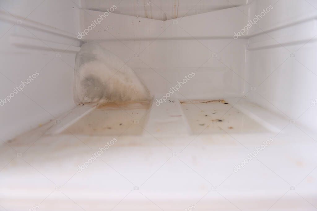 Dirty, unwashed and frosty refrigerator. Violation and non-compliance with sanitary and epidemiological standards, irresponsible attitude to the content of food in the refrigerator and freezers.