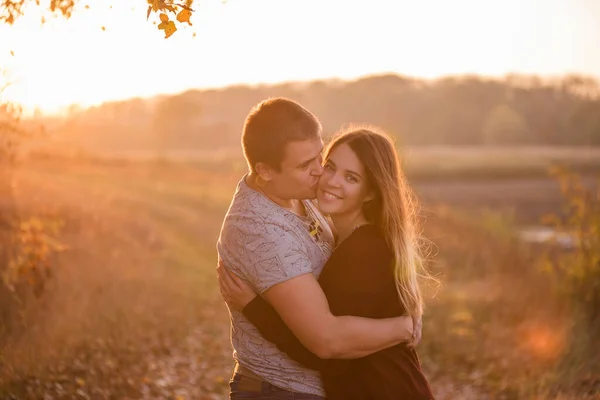 Young Man Kisses Hugs Beautiful Smiling Blonde Girl Long Hair — Stock Photo, Image