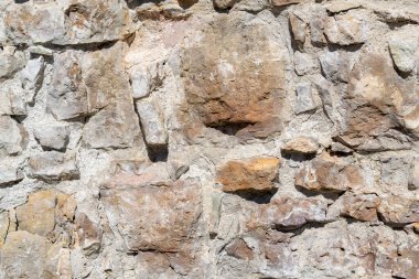 Eskimemiş, kaba, düzensiz granit duvar. Doğal desenli arkaplan.