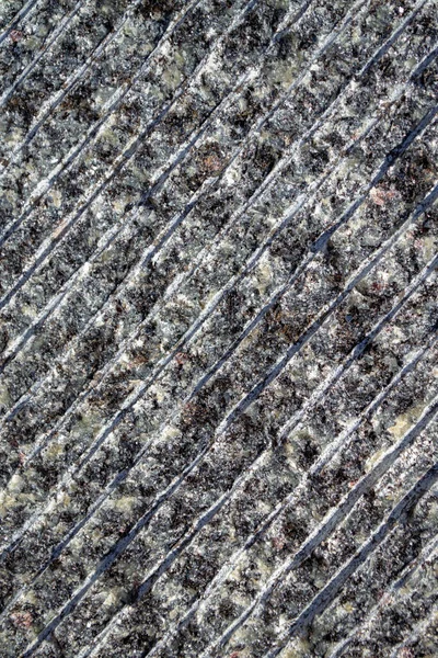 Diagonaal gesneden grijze steen. Gestreept marmeren oppervlak. — Stockfoto