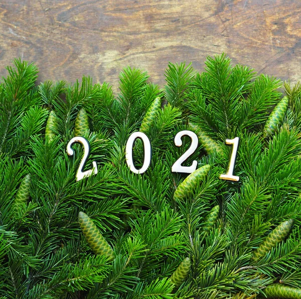 New Year Greetings Fir Branches Laid Out Brown Background Place — Stock Photo, Image